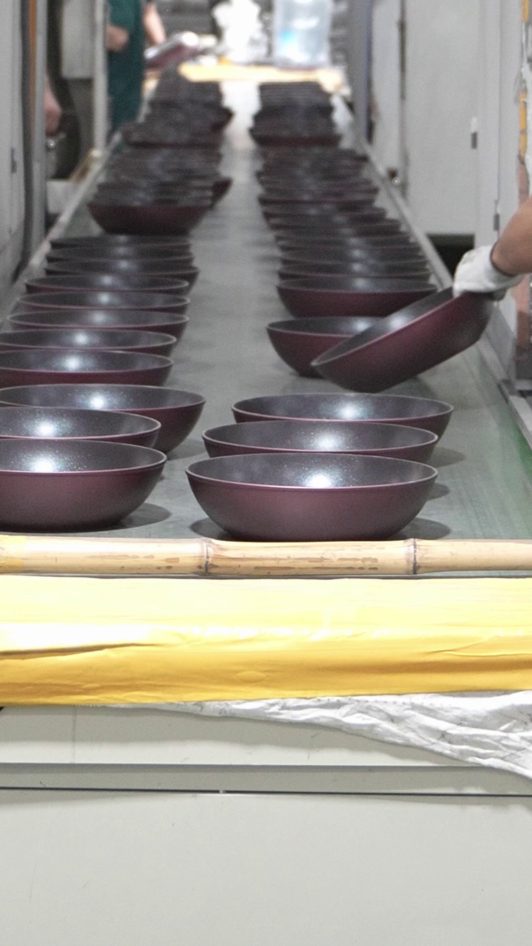 Cookware being handled on the YOUME production line